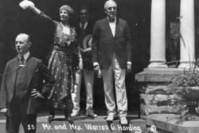 It was U.S. President Harding who would coin the enduring phrase Founding Fathers to describe the people who helped shape the U.S. during the Revolutionary era. He's pictured here with his wife Florence on the front porch of the Harding house in Marion, Ohio.
