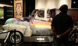 A visitor to the Peterson Automobile Museum examines a lowrider 1953 Chevrolet ice cream truck named &quot;El Chavez Ravine&quot; in Los Angeles, Calif.
