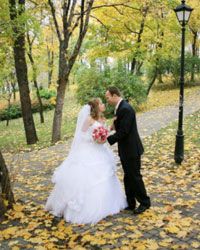 Autumn leaves provide a beautiful backdrop for your wedding portraits.