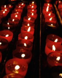 Votives with a flickering amber flame provide instant ambience for your Halloween wedding