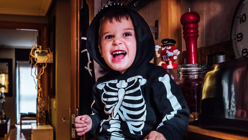 kid in skeleton costume