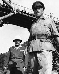 Alec Guinness, right, is shown in this scene from the film "Bridge on the River Kwai."”border=