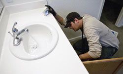 Have the home inspector check the bathroom sink, but have someone else fix it.