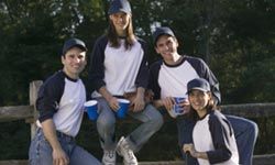 men and women playing softball