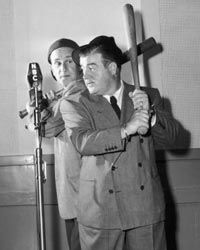 American comedy duo Bud Abbott and Lou Costello performing their famous "Who's On First" routine for a 1947 NBC radio broadcast.