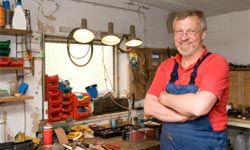 senior man standing in carpentry workshop