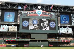 The scoreboard at Chase Field dwarfs players and fans alike. This photo was taken on April 15, 2009, in a game against the St. Louis Cardinals.