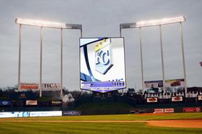 The Royals' screen in Kansas City, Mo., shown on April 9, 2008, before a game against the New York Yankees, towers over the stadium.