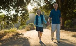 Senior couple walking in park