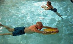 Senior citizens swimming in pool