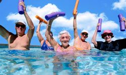 Senior citizens in water aerobics class