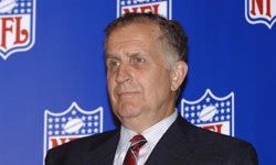 Retiring NFL commissioner Paul Tagliabue watches as his successor Roger Goodell talks to the media at an owners meeting in suburban Chicago in 2006.