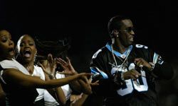 Sean "P. Diddy" Combs gets his groove on during the halftime show at Super Bowl XXXVIII in Houston.”border=