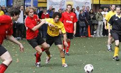 Grassroot soccer organizer and "Survivor" winner Ethan Zohn (yellow shirt) plays in the Grassroot Soccer UNITED celebrity soccer match in New York City in 2008.”border=