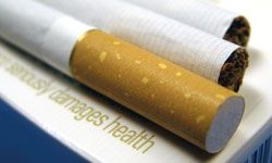 Cigarettes on paper showing damage to health