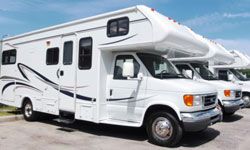 Row of new RVs at car lot