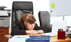 Unhappy businesswoman in office