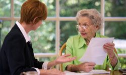 Mature woman talking to financial planner