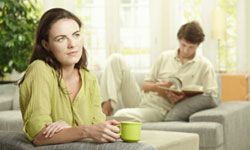 Couple with woman looking thoughtful