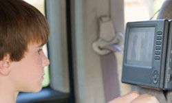 child watching television in car