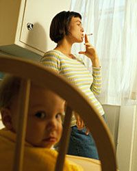 Mom smoking in front of toddler