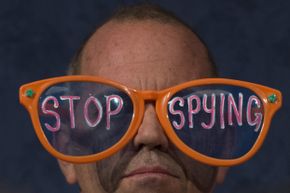 A protester with the group Code Pink demonstrates against the U.S. National Security Agency's practice of secretly collecting people's phone records and Internet activity data. See spy pictures.