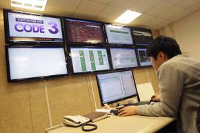 An IT security researcher looks for computer viruses in Seoul, South Korea in 2013. A cyberattack on the networks that ran three banks, two broadcasters and an ISP was traced to an IP address in China, but experts think the attacks were from North Korea.