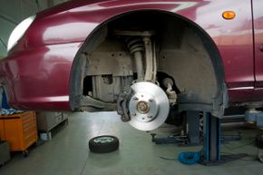 If axle grease or caliper lube gets on the friction surface of the brake pads or rotors, your car's brakes won't work.