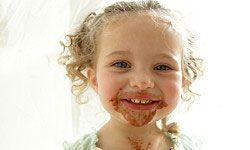 little girl with chocolate face