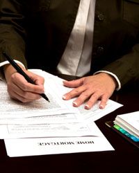 Lender working on mortgage paperwork