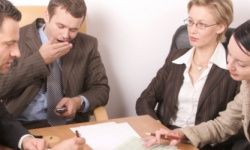 man yawning in meeting