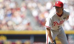 Cole Hamels of the Philadelphia Phillies pitches in a baseball game