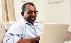 senior man using laptop computer