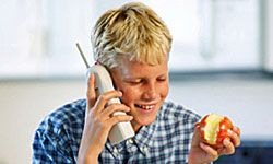 tween boy eating an apple