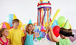 children playing with a pinata