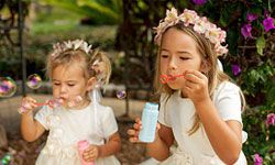 Flower girls can toss petals and blow bubbles at the send-off.