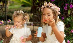 flower girls blowing bubbles