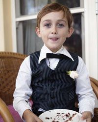 little ring bearer with clean buffet plate