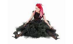 Woman with pink hair and frilly black dress