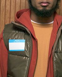 Man wearing a blank name sticker