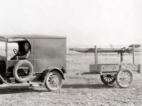 Dr. Robert Goddard, one of the fathers of modern rocketry, tows a rocket to its launch site 15 miles northwest of Roswell, New Mexico. Dr. Goddard most likely knew the importance of keeping speed to a minimum.