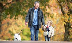 father and son walking in the park