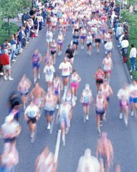 blurred image of people running a marathon