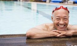 mature Asian man in swimming pool