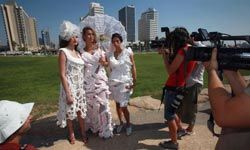 women wearing wedding dresses made of toilet paper