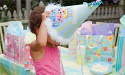 little girl in party hat