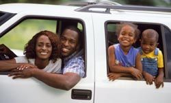 african-american family in car on a road trip