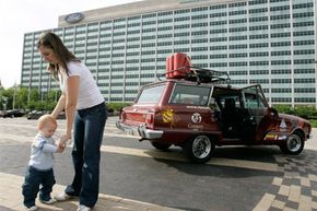 Cecilia Percivaldi with her son Agustin, next the family's 1981 Ford Falcon at Ford Motor Co.'s headquarters in Dearborn, Mich. The Percivaldi family drove almost 10,000 miles through 11 countries, from Argentina to Dearborn. The trip took 47 days.