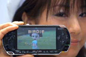 A model shows a PlayStation Portable (PSP) manufactured by Sony Computer Entertainment, Sony Corp.'s video-game unit.