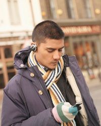 Man looking at mp3 player